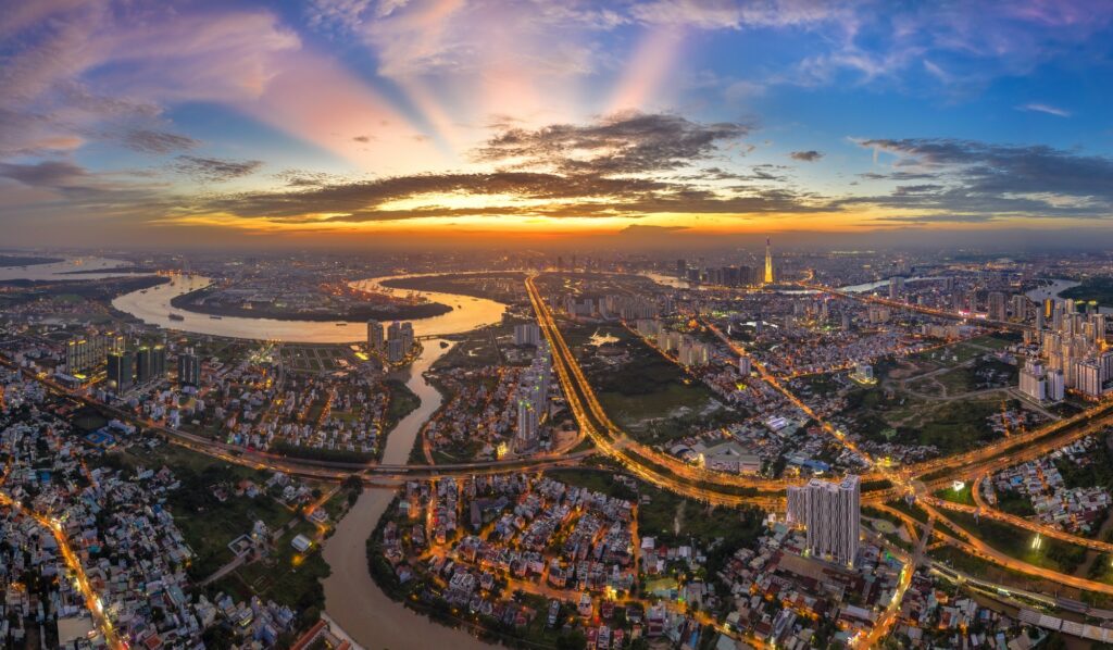Top View Aerial Of Mai Chi Tho Road, Thu Thiem Peninsula And Center Ho Chi Minh City, Vietnam With Development Buildings, Transportation, Energy Power Infrastructure. View From District 2