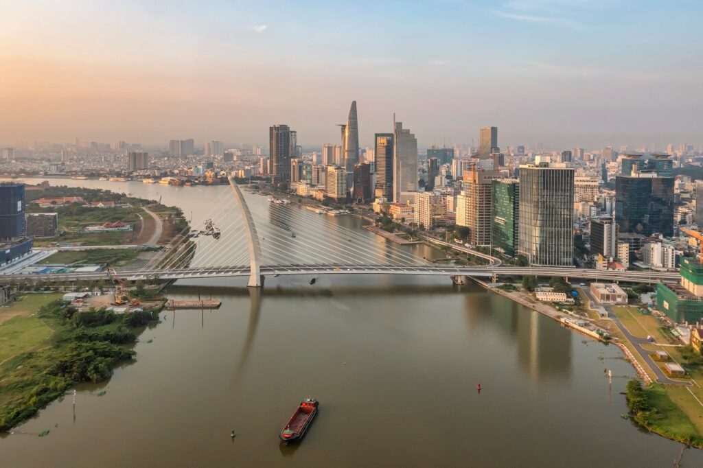 Top View Aerial Photo From Flying Drone Of A Ho Chi Minh City With Development Buildings, Transportation, Energy Power Infrastructure.