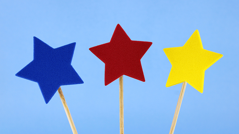 Wooden Sticks With Three Stars Of Different Colors